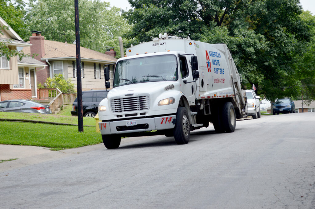 American Waste Trash Truck in neighborhood