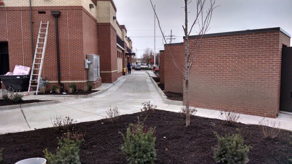 Kansas City street sweeping after picture of construction track out