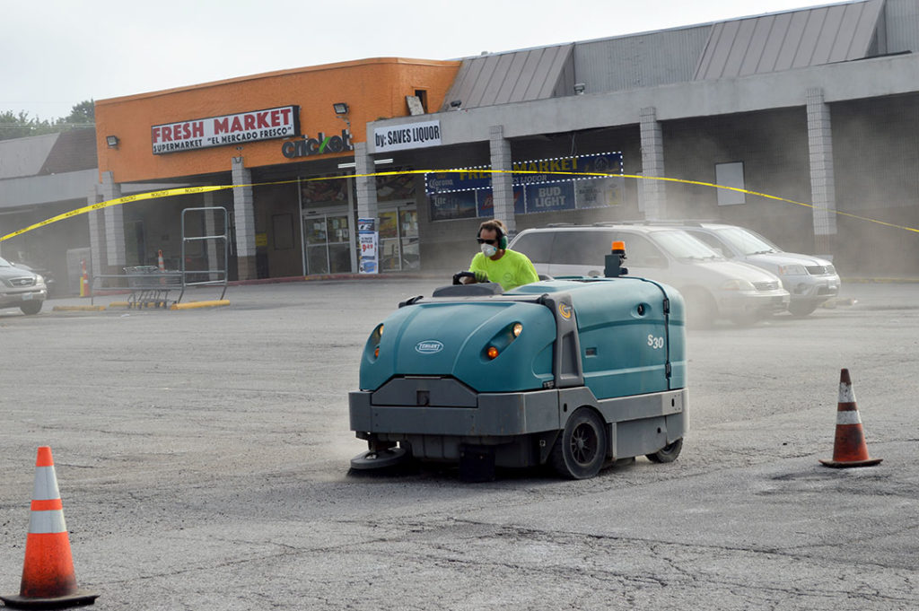 Tennant preparing parking lot surface before asphalt paving in Kansas City